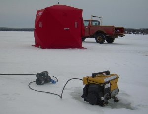an ice-fishing tent with generator and compressor